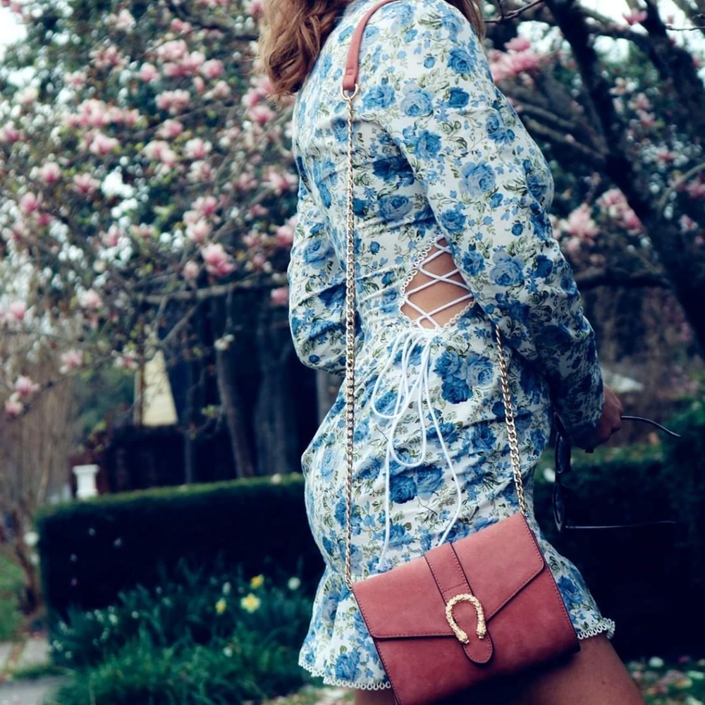 PLT floral mini dress. Side cut outs with lace up.